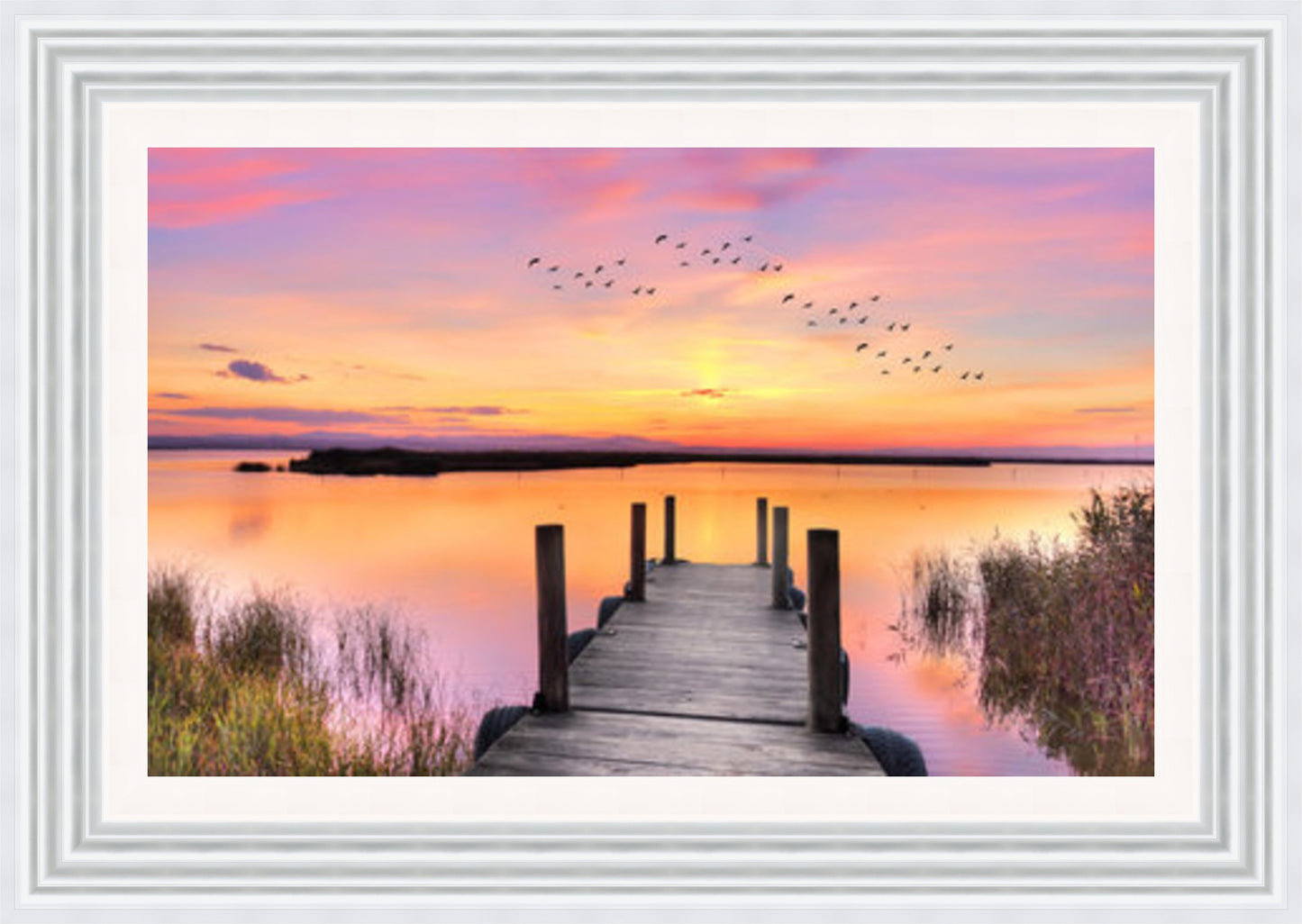 Pier on lake at Sunset